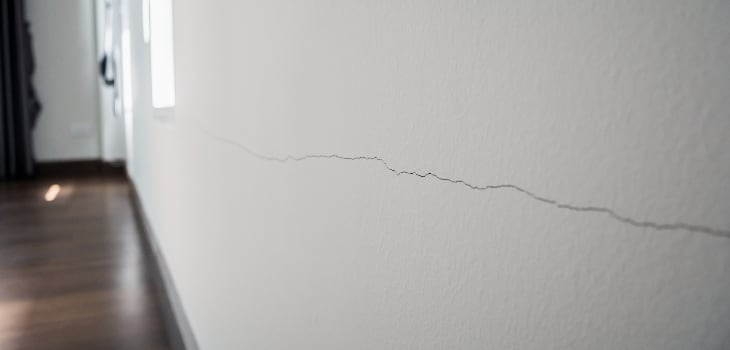 Cracking of paint on white walls